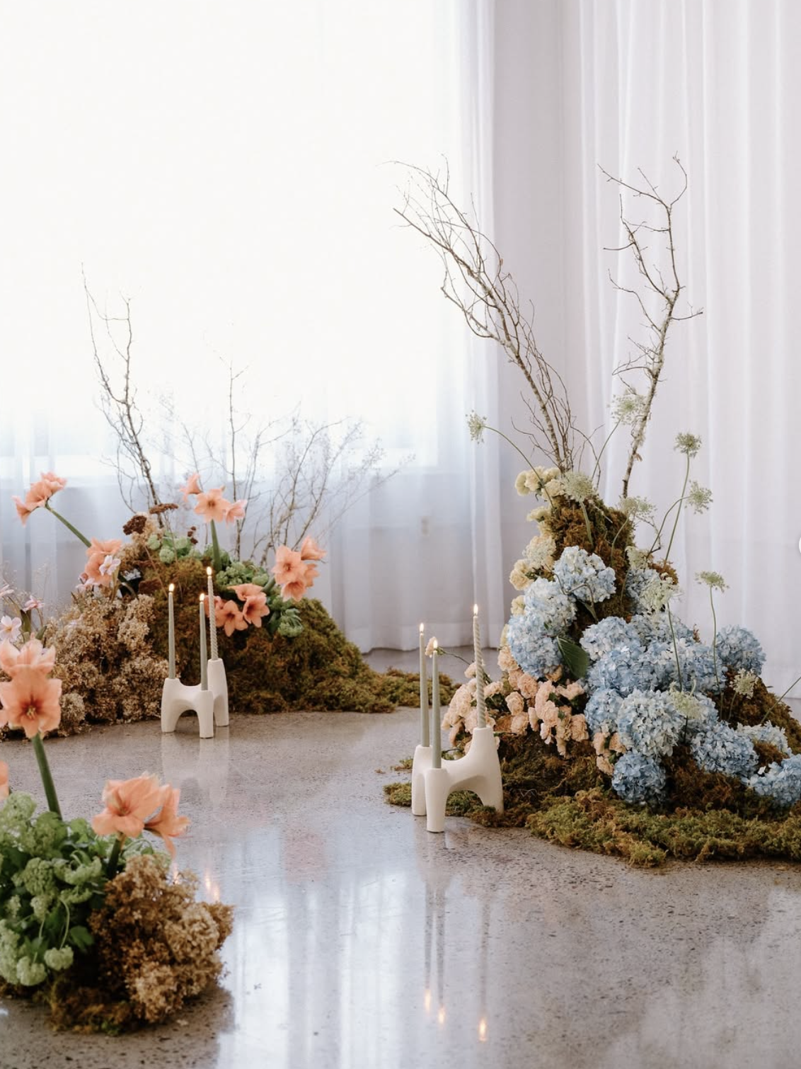 The White Room styled garden-inspired with moss, hydrangea and taper candles
